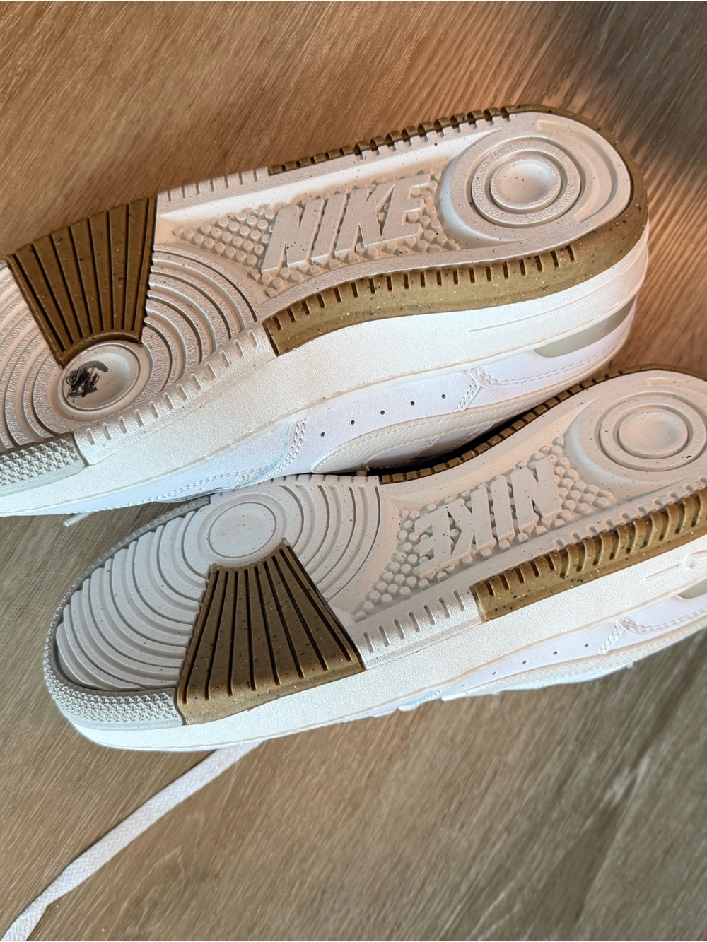Nike Women’s White Sneakers with Brown Gum Outsole Accents